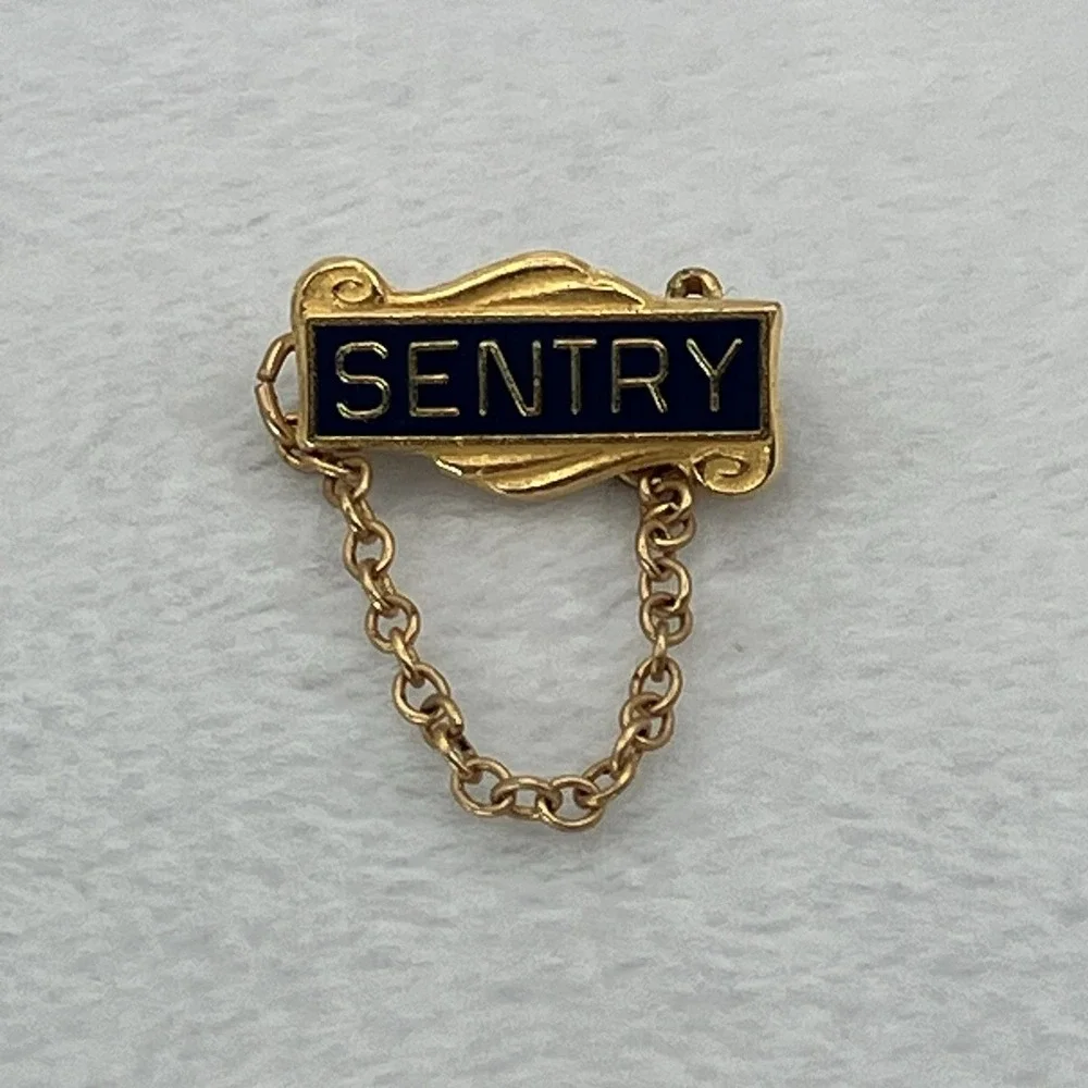 Vintage Sentry Insurance Gold Tone Black Enamel Lapel Pin Tie Tack Safety Chain